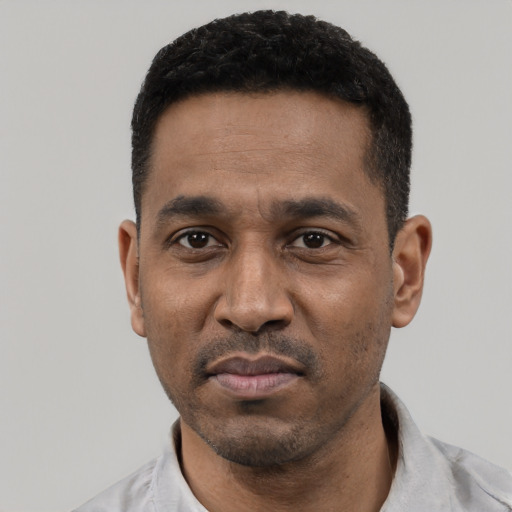 Neutral black young-adult male with short  black hair and brown eyes