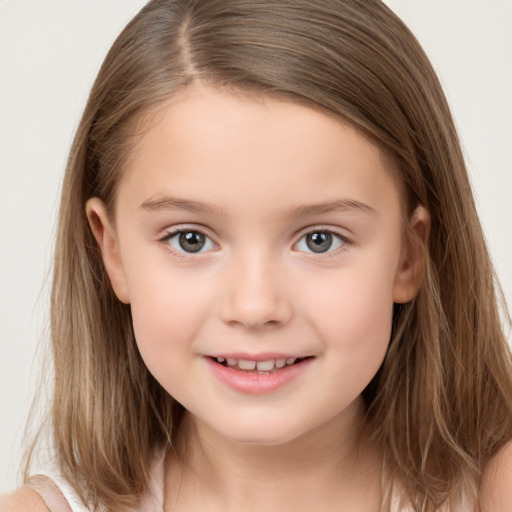 Joyful white child female with long  brown hair and brown eyes