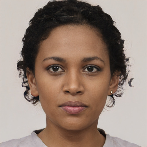 Neutral black young-adult female with short  black hair and brown eyes