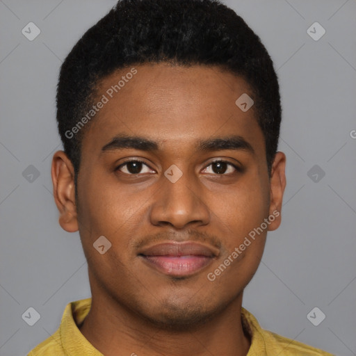 Joyful black young-adult male with short  brown hair and brown eyes