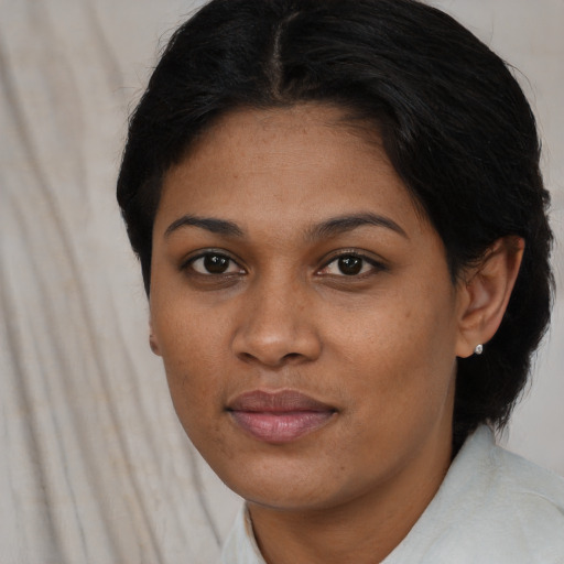 Joyful asian young-adult female with short  brown hair and brown eyes