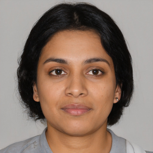 Neutral latino young-adult female with medium  black hair and brown eyes