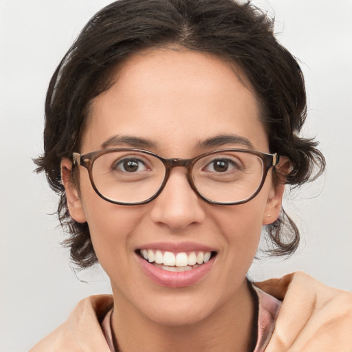 Joyful white young-adult female with medium  brown hair and brown eyes