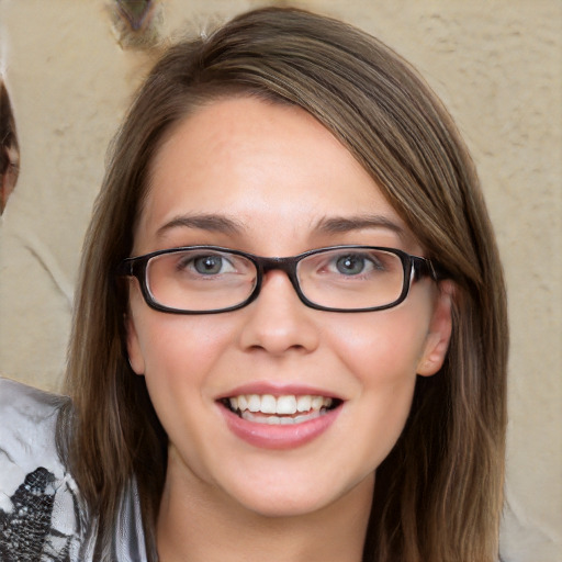 Joyful white young-adult female with medium  brown hair and blue eyes