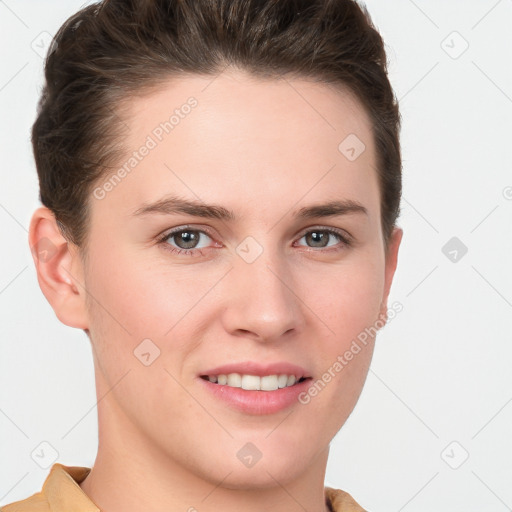 Joyful white young-adult female with short  brown hair and grey eyes