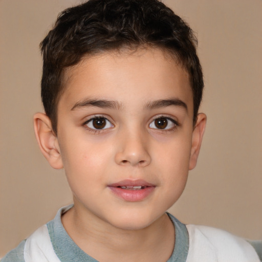 Joyful white child male with short  brown hair and brown eyes