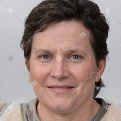 Joyful white adult female with short  brown hair and grey eyes