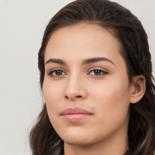 Neutral white young-adult female with long  brown hair and brown eyes