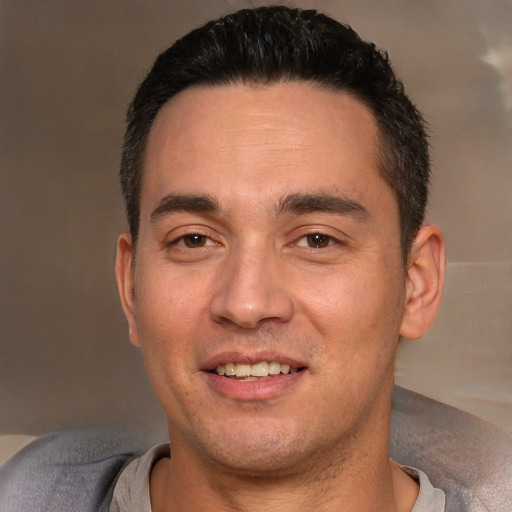 Joyful white adult male with short  brown hair and brown eyes