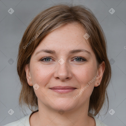 Joyful white young-adult female with medium  brown hair and grey eyes