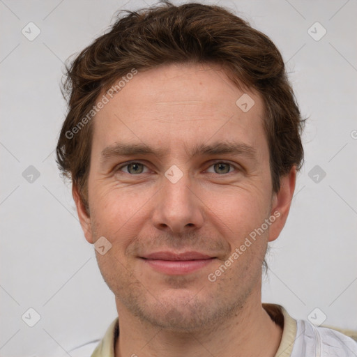 Joyful white adult male with short  brown hair and grey eyes