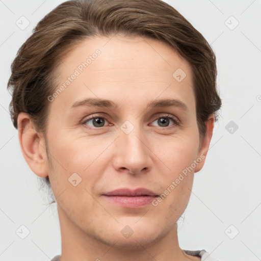 Joyful white young-adult female with short  brown hair and grey eyes