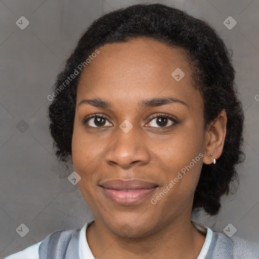 Joyful black young-adult female with medium  brown hair and brown eyes