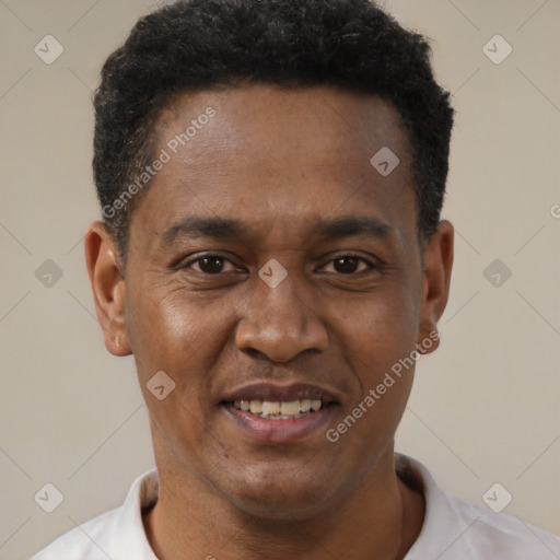 Joyful latino young-adult male with short  brown hair and brown eyes