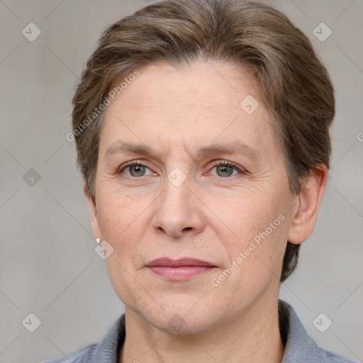 Joyful white adult female with short  brown hair and grey eyes