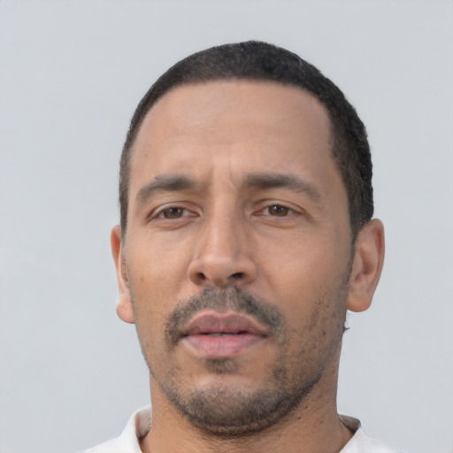 Neutral white adult male with short  black hair and brown eyes