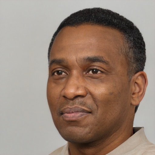 Neutral black adult male with short  black hair and brown eyes
