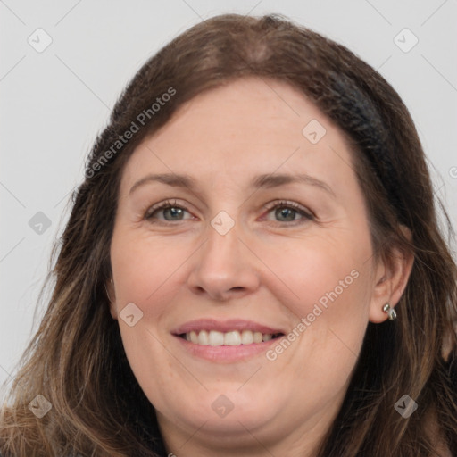 Joyful white adult female with long  brown hair and brown eyes