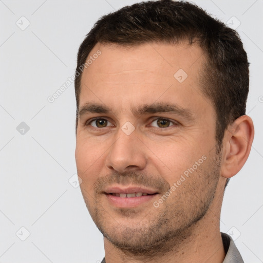 Joyful white young-adult male with short  brown hair and brown eyes