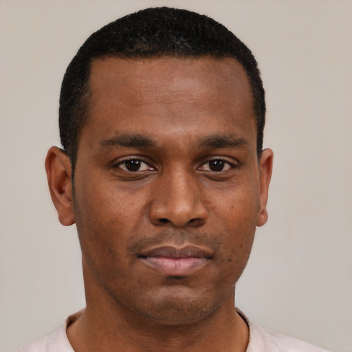 Neutral black young-adult male with short  black hair and brown eyes
