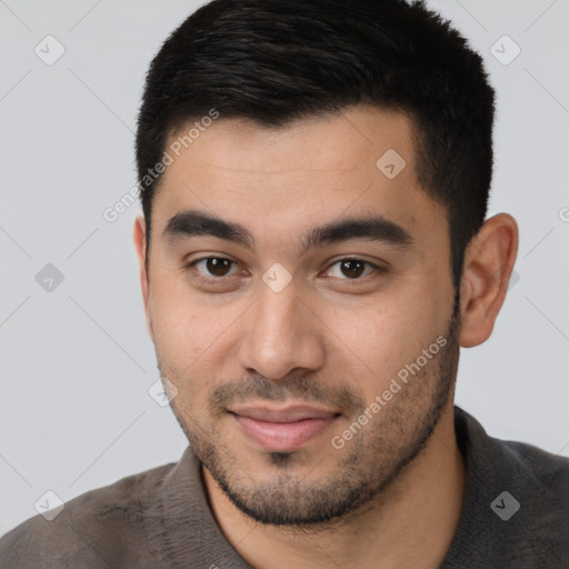 Joyful latino young-adult male with short  brown hair and brown eyes