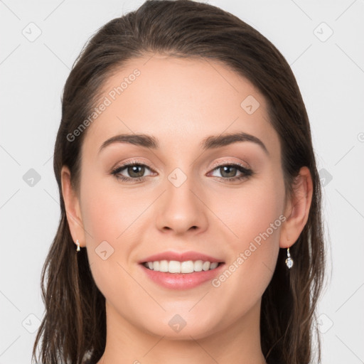 Joyful white young-adult female with long  brown hair and grey eyes