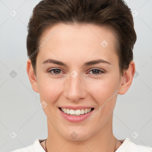 Joyful white young-adult female with short  brown hair and brown eyes