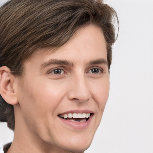 Joyful white young-adult male with medium  brown hair and brown eyes