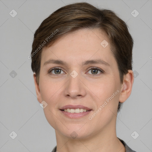 Joyful white young-adult female with short  brown hair and grey eyes