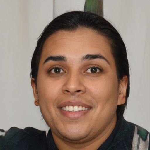 Joyful latino young-adult female with medium  brown hair and brown eyes