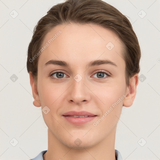 Joyful white young-adult female with short  brown hair and grey eyes