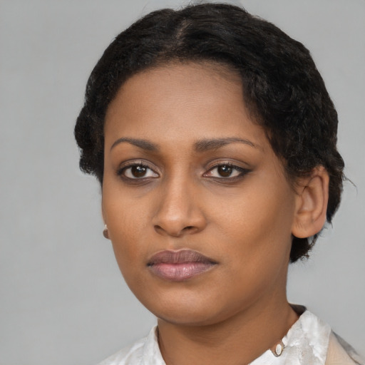 Neutral black young-adult female with short  black hair and brown eyes