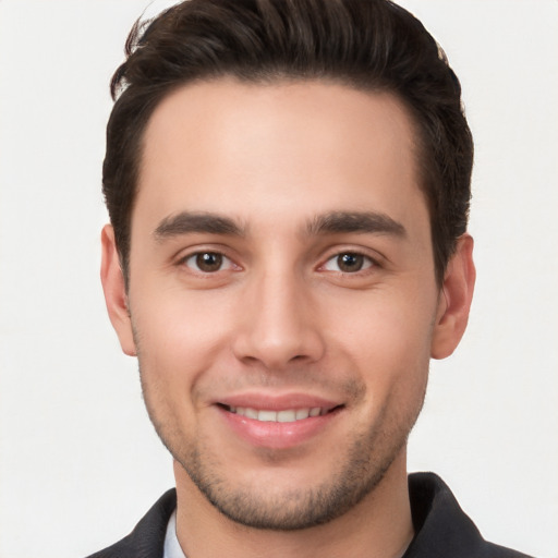 Joyful white young-adult male with short  brown hair and brown eyes