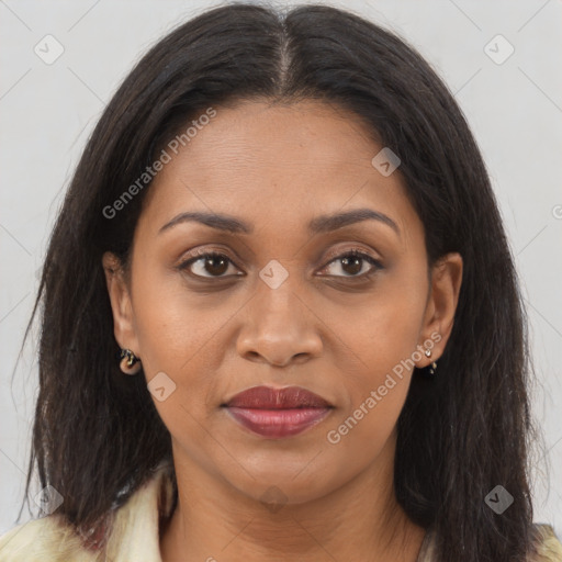 Joyful black young-adult female with long  brown hair and brown eyes