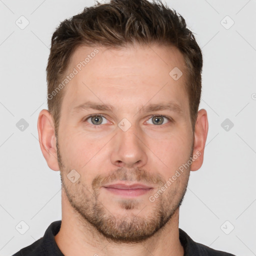 Joyful white adult male with short  brown hair and grey eyes