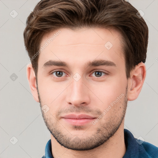 Neutral white young-adult male with short  brown hair and grey eyes