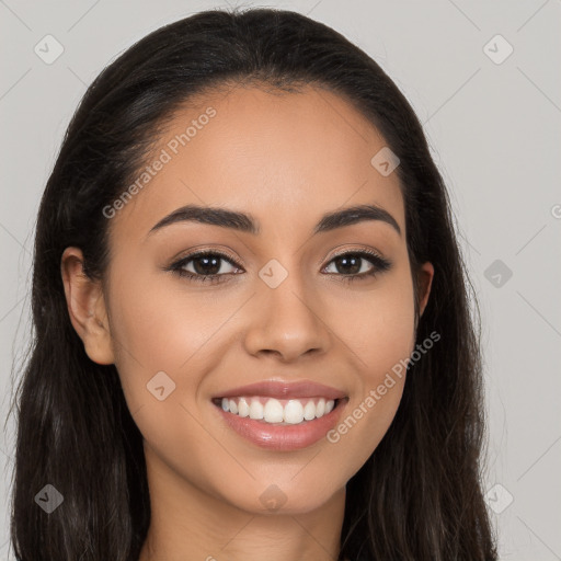 Joyful latino young-adult female with long  brown hair and brown eyes