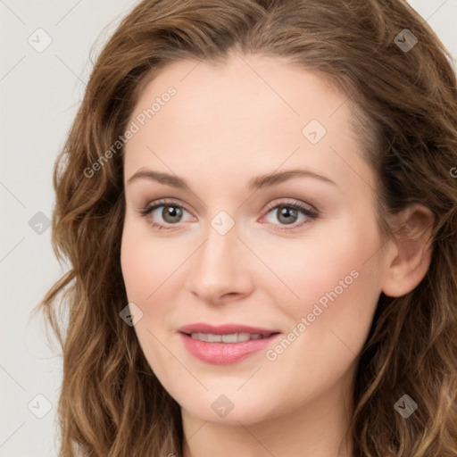 Joyful white young-adult female with long  brown hair and green eyes