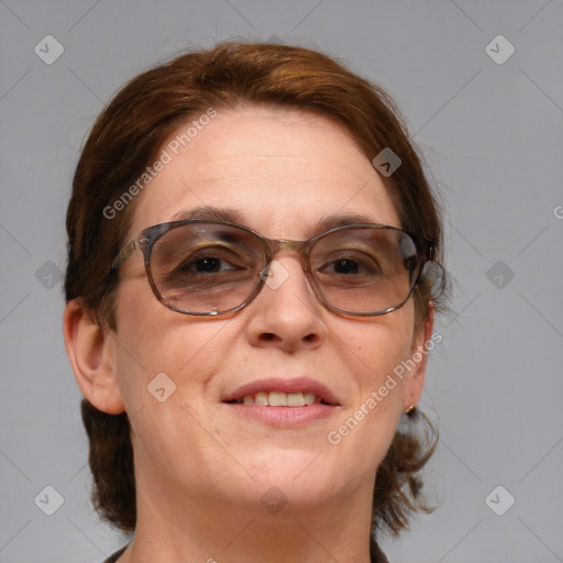 Joyful white adult female with medium  brown hair and blue eyes