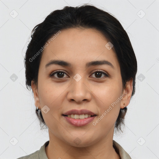 Joyful latino young-adult female with medium  brown hair and brown eyes