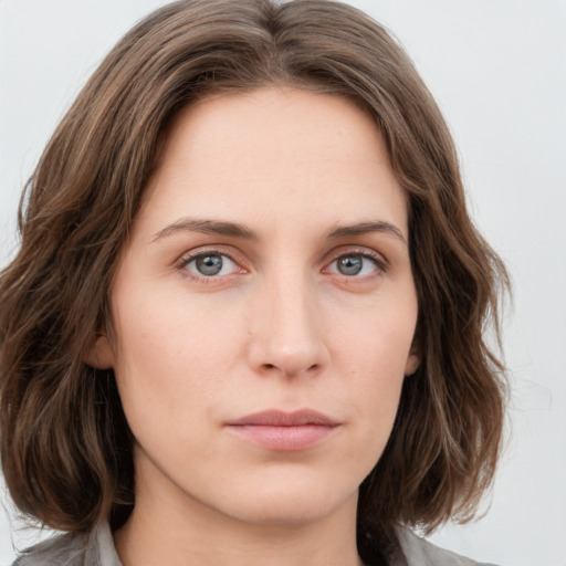 Neutral white young-adult female with medium  brown hair and green eyes