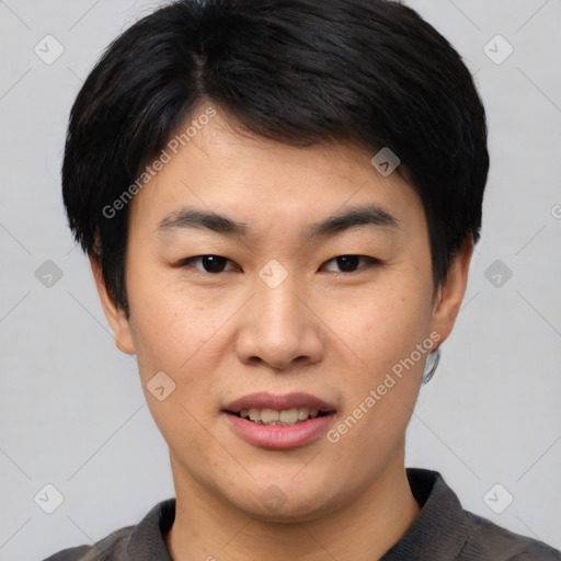 Joyful asian young-adult male with short  black hair and brown eyes