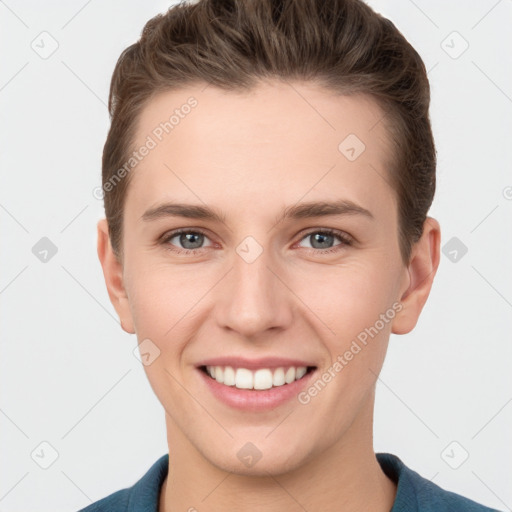 Joyful white young-adult female with short  brown hair and grey eyes