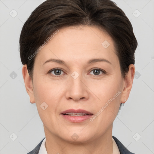 Joyful white adult female with short  brown hair and brown eyes