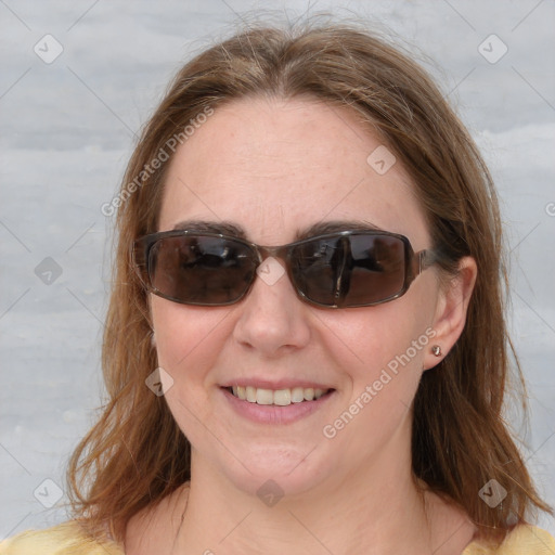 Joyful white young-adult female with medium  brown hair and blue eyes