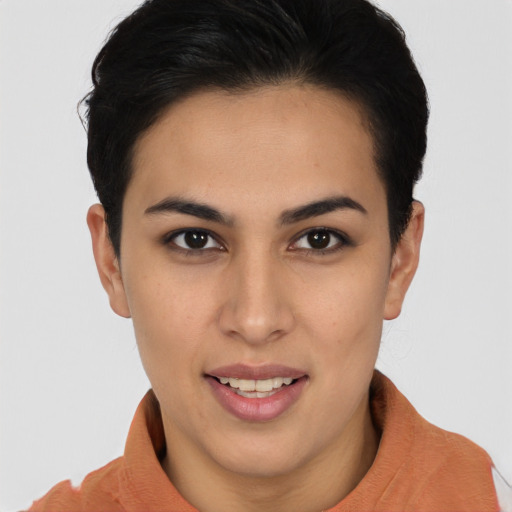 Joyful latino young-adult female with short  brown hair and brown eyes