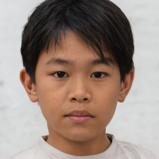 Neutral asian child male with short  brown hair and brown eyes