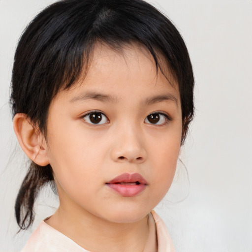 Neutral asian child female with medium  brown hair and brown eyes