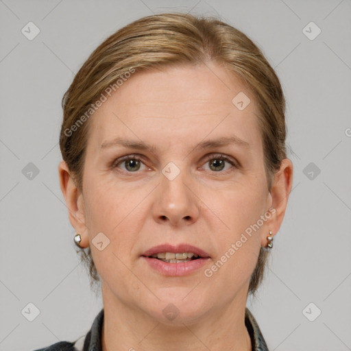 Joyful white adult female with medium  brown hair and grey eyes