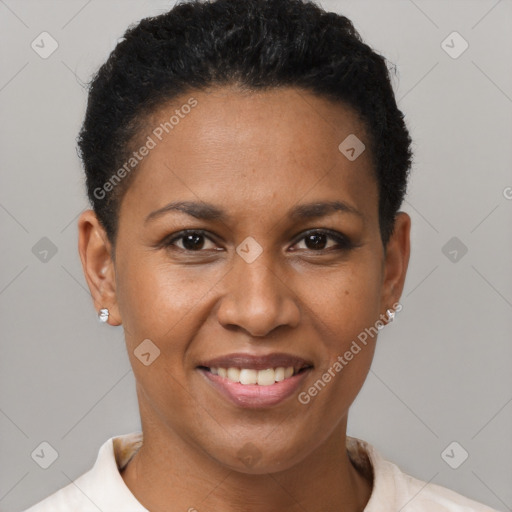 Joyful black adult female with short  brown hair and brown eyes